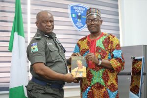 PRESENTATION OF BOOK TO AIG Tunji Disu