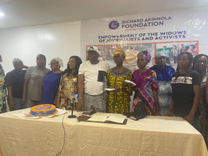 Mr-Richard-Akinnola-and-the-women-beneficiaries